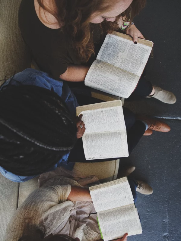 A group of people reading their Bibles