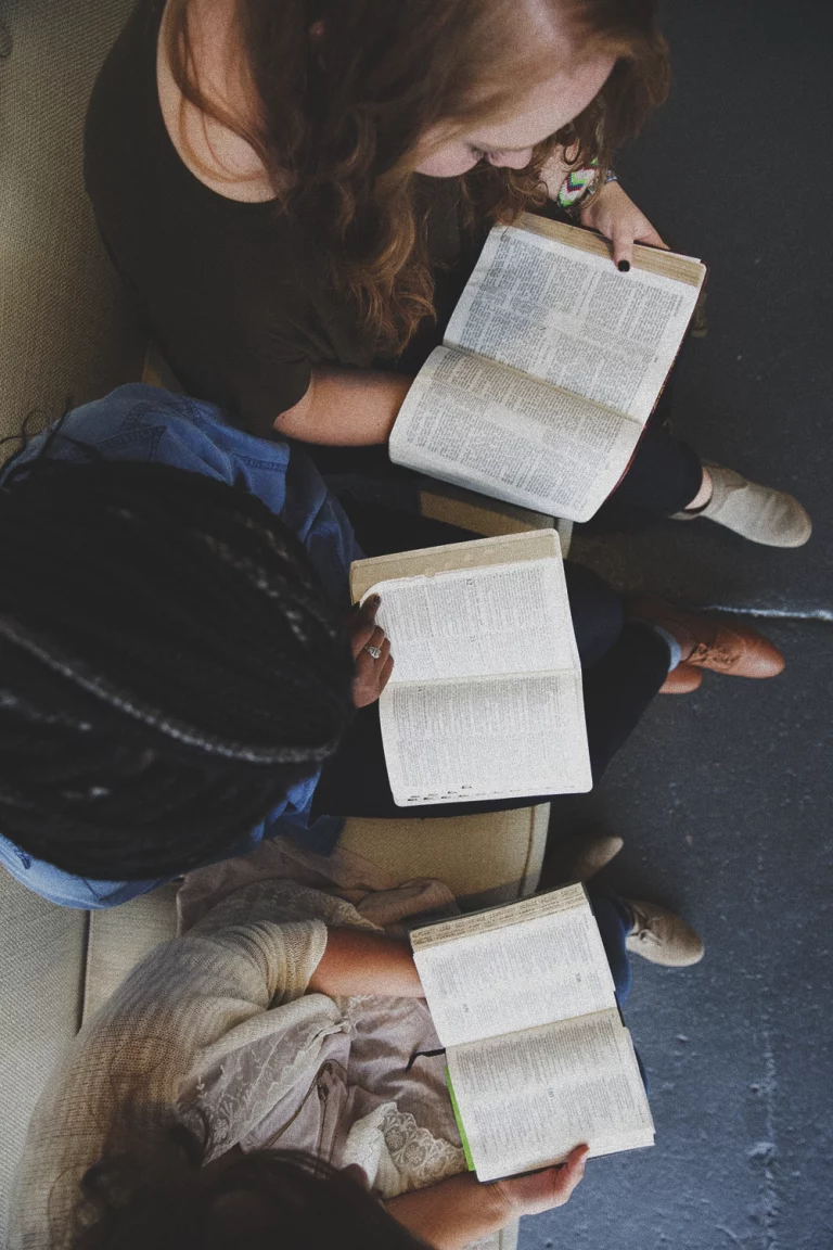 A group of people reading their Bibles